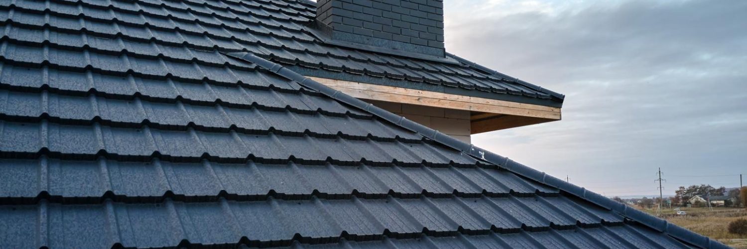 closeup-of-house-roof-top-covered-with-metallic-sh-2023-11-27-05-35-27-utc.jpg closeup-of-house-roof-top-covered-with-metallic-sh-2023-11-27-05-35-27-utc.jpg